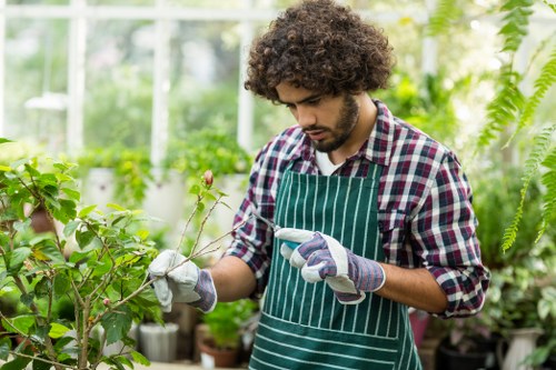 A senior landscaper checking records during a complaint review